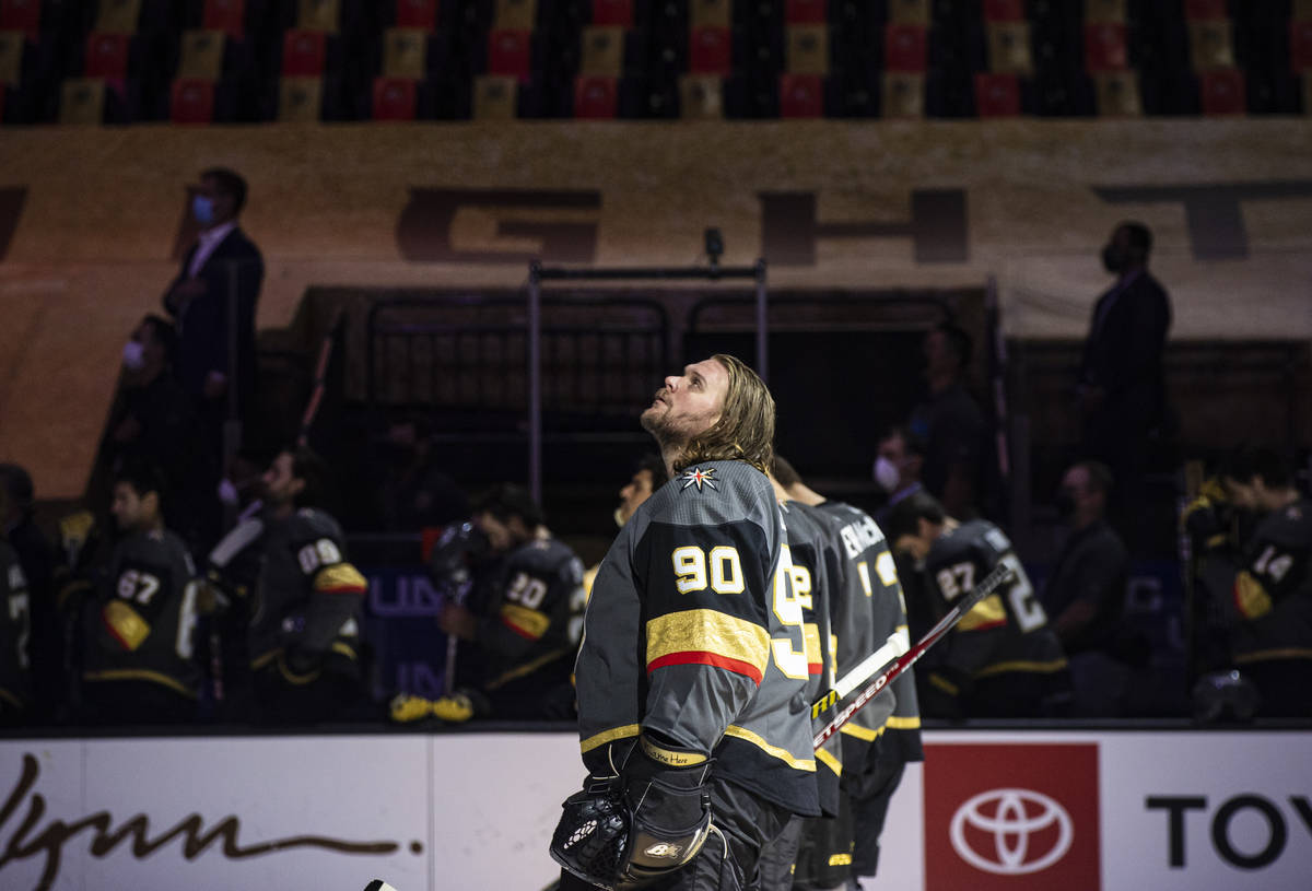 Golden Knights goaltender Robin Lehner (90) looks on while standing for the national anthem bef ...