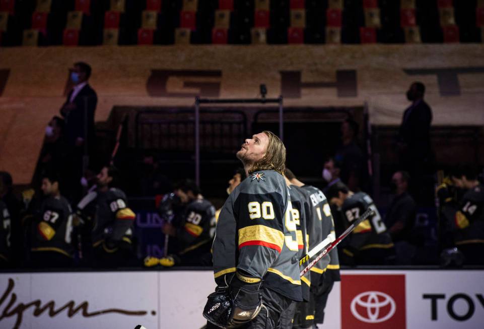 Golden Knights goaltender Robin Lehner (90) looks on while standing for the national anthem bef ...