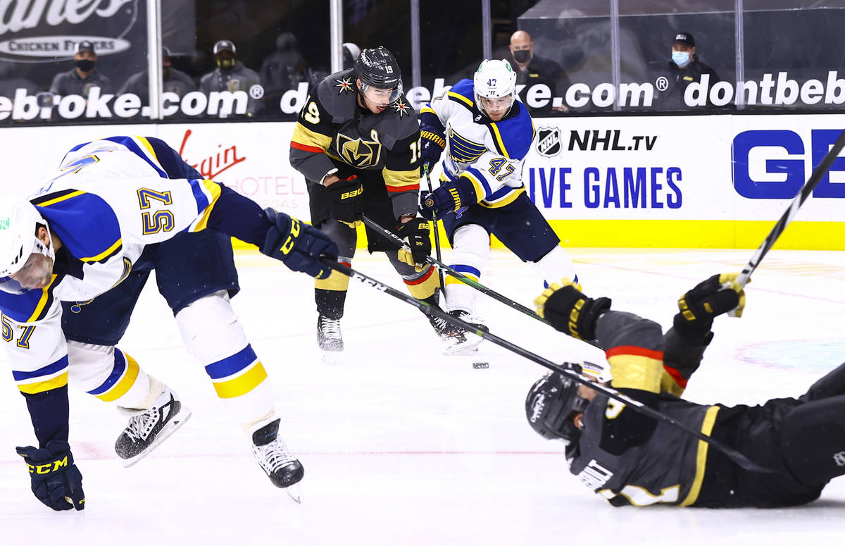 Golden Knights right wing Reilly Smith (19) and St. Louis Blues defenseman Torey Krug (47) batt ...