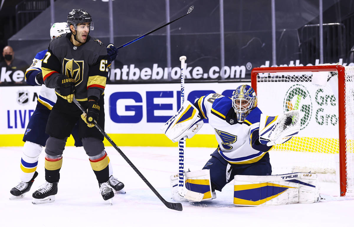 St. Louis Blues goaltender Jordan Binnington (50) stops the puck as Golden Knights left wing Ma ...