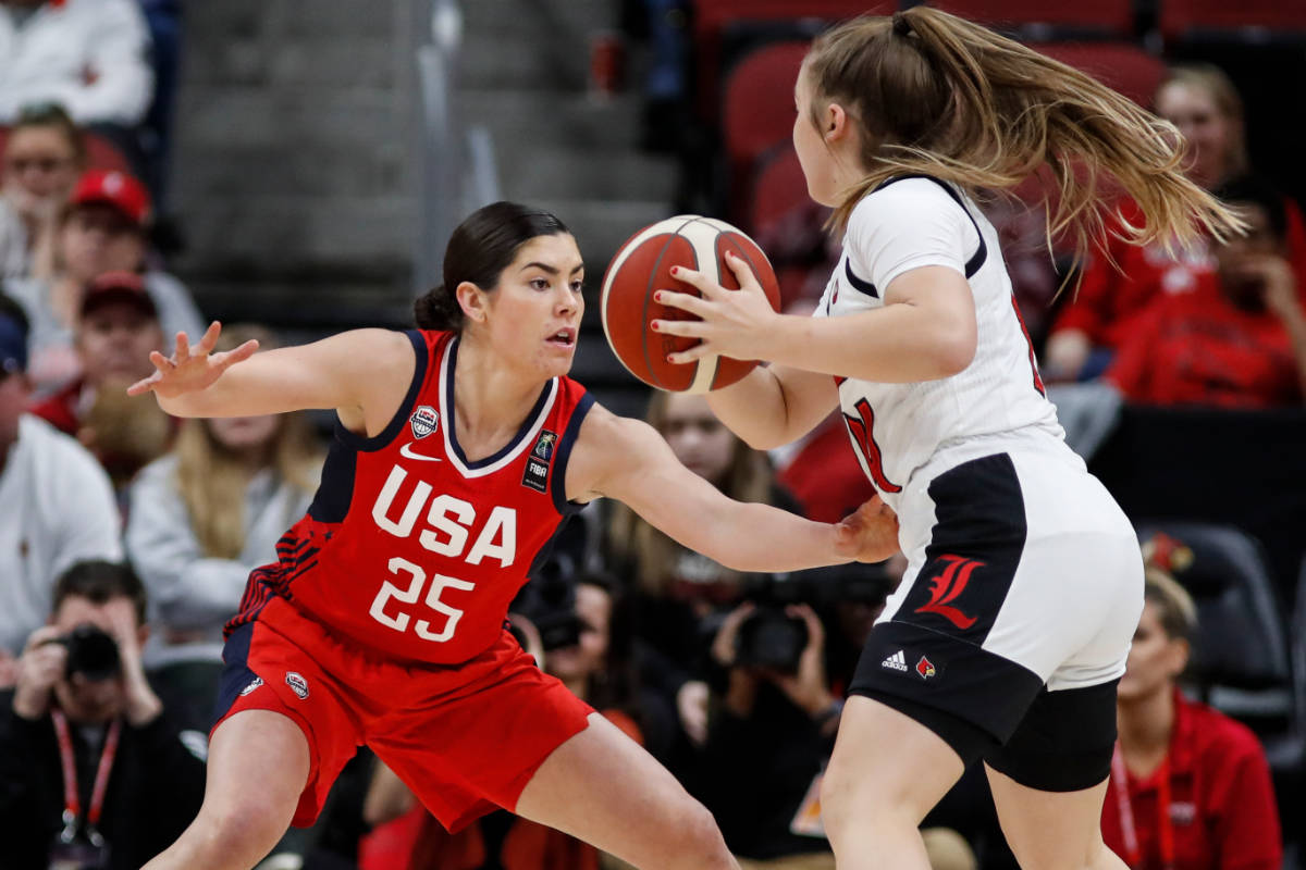 USA Women's National Team guard Kelsey Plum (25) defends against Louisville guard Jessica Laemm ...