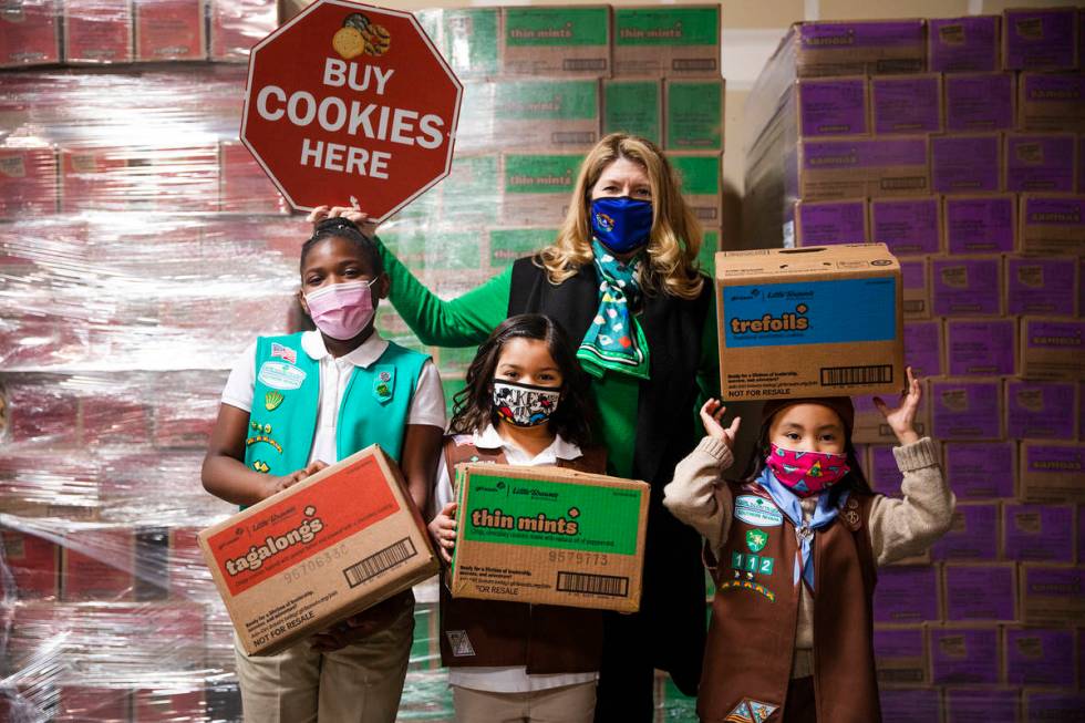 Girl Scouts Aliyah H., 9, from left, Ariana H., 7, Kimberly Trueba, CEO of Girl Scouts of South ...