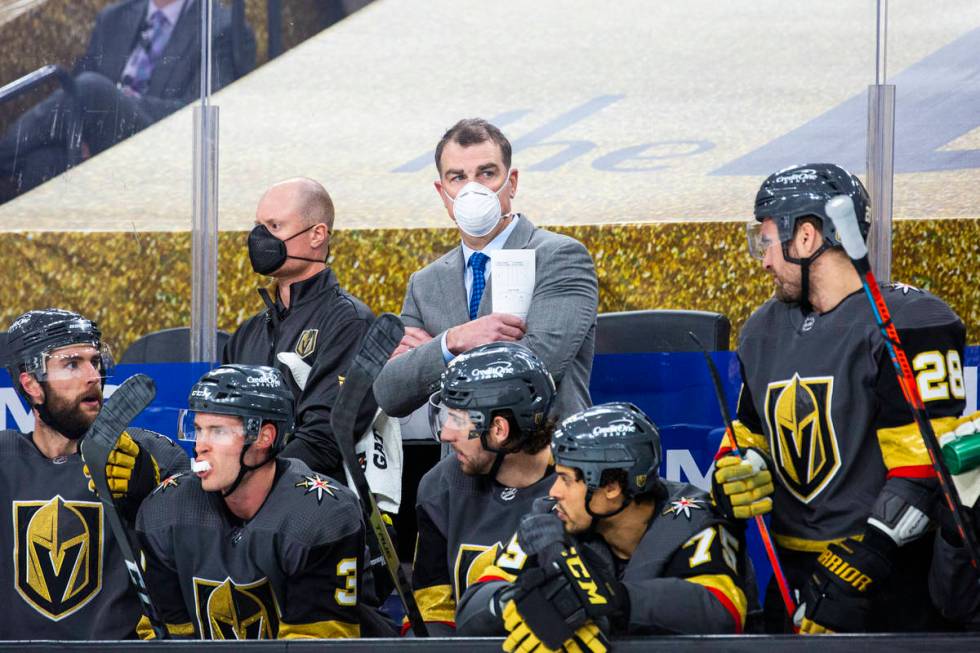 Silver Knights assistant coach Jamie Heward, center, looks on from the Golden Knights bench dur ...
