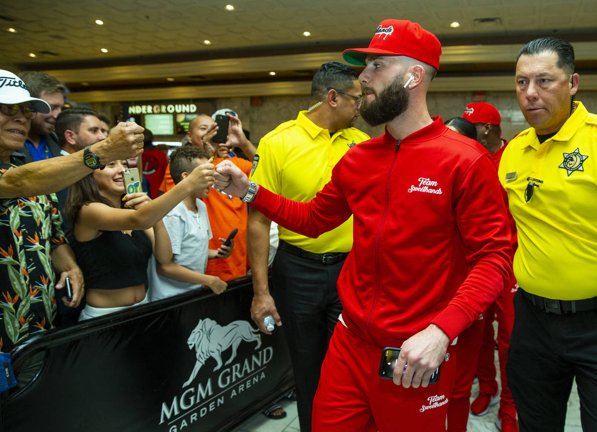 Boxer Caleb Plant greets fans on his way to the stage during fighter grand arrivals at the MGM ...