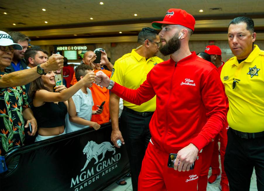 Boxer Caleb Plant greets fans on his way to the stage during fighter grand arrivals at the MGM ...
