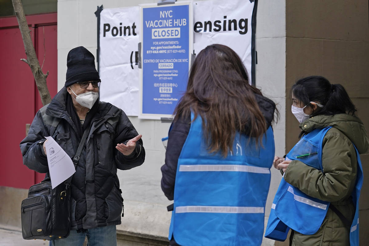 In a Jan. 21, 2021, file photo, a man who came to get a COVID-19 vaccine holds his paperwork as ...