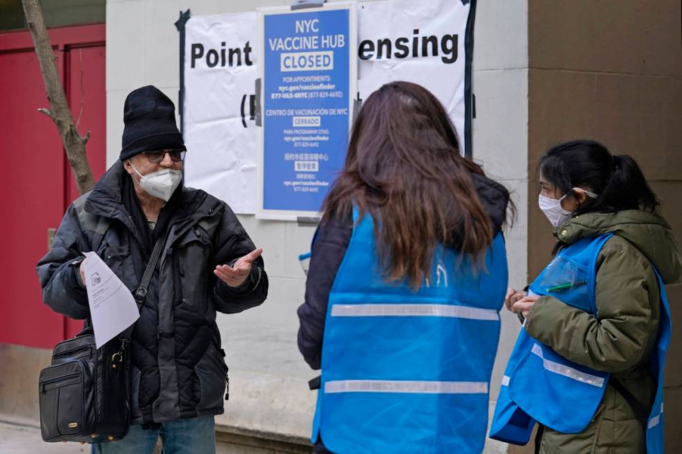 In a Jan. 21, 2021, file photo, a man who came to get a COVID-19 vaccine holds his paperwork as ...