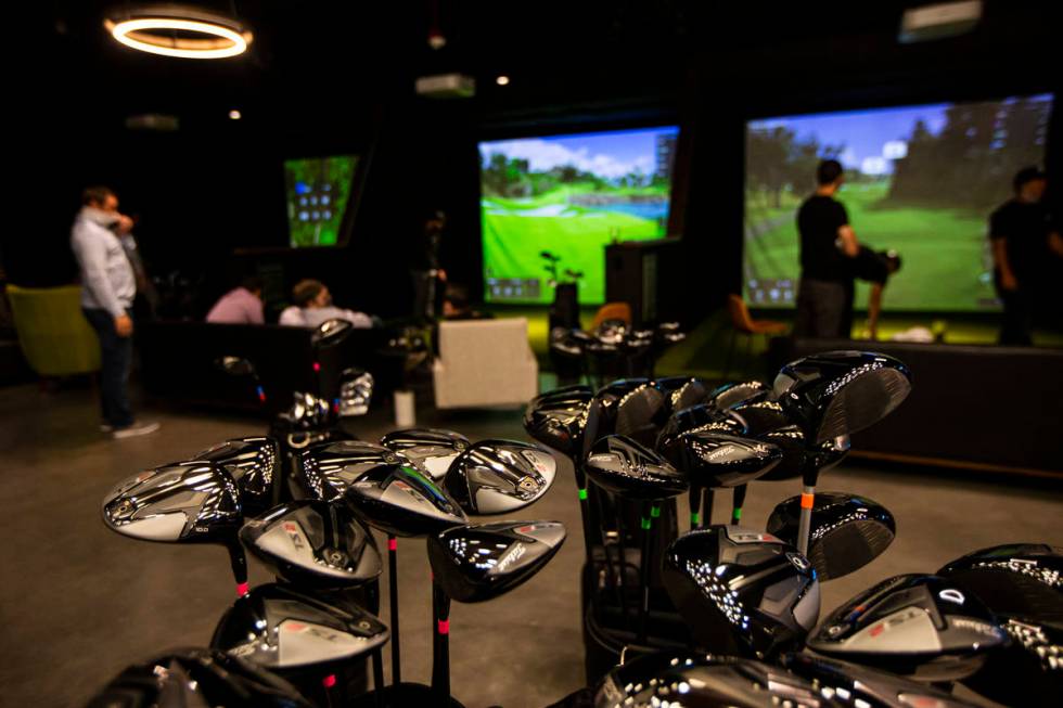 Golf clubs are seen during a friends and family event at Five Iron Golf at Area15 in Las Vegas ...