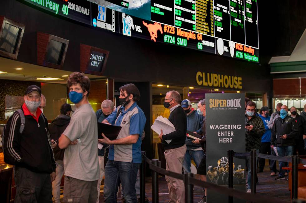 Bettors wait in line as the Westgate sportsbook posts hundreds of Super Bowl prop bets on Thurs ...