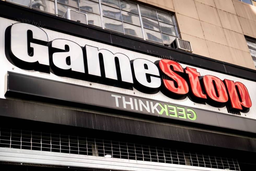 Pedestrians pass a GameStop store on 14th Street at Union Square, Thursday, Jan. 28, 2021, in t ...