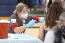 Pleasant Ridge School Nurse Gina Shield administers a coronavirus vaccine Wednesday, Jan. 28, 2 ...