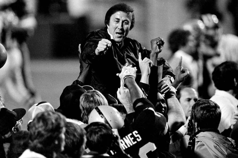 In this Jan. 23, 1984, file photo, coach Tom Flores gestures to members of the Los Angeles Raid ...