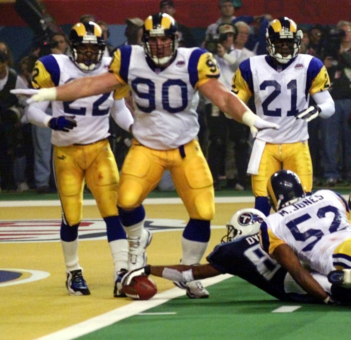 In this Jan. 30, 2000, file photo, St. Louis Rams' Jeff Zgonina (90) signals "no score" after T ...
