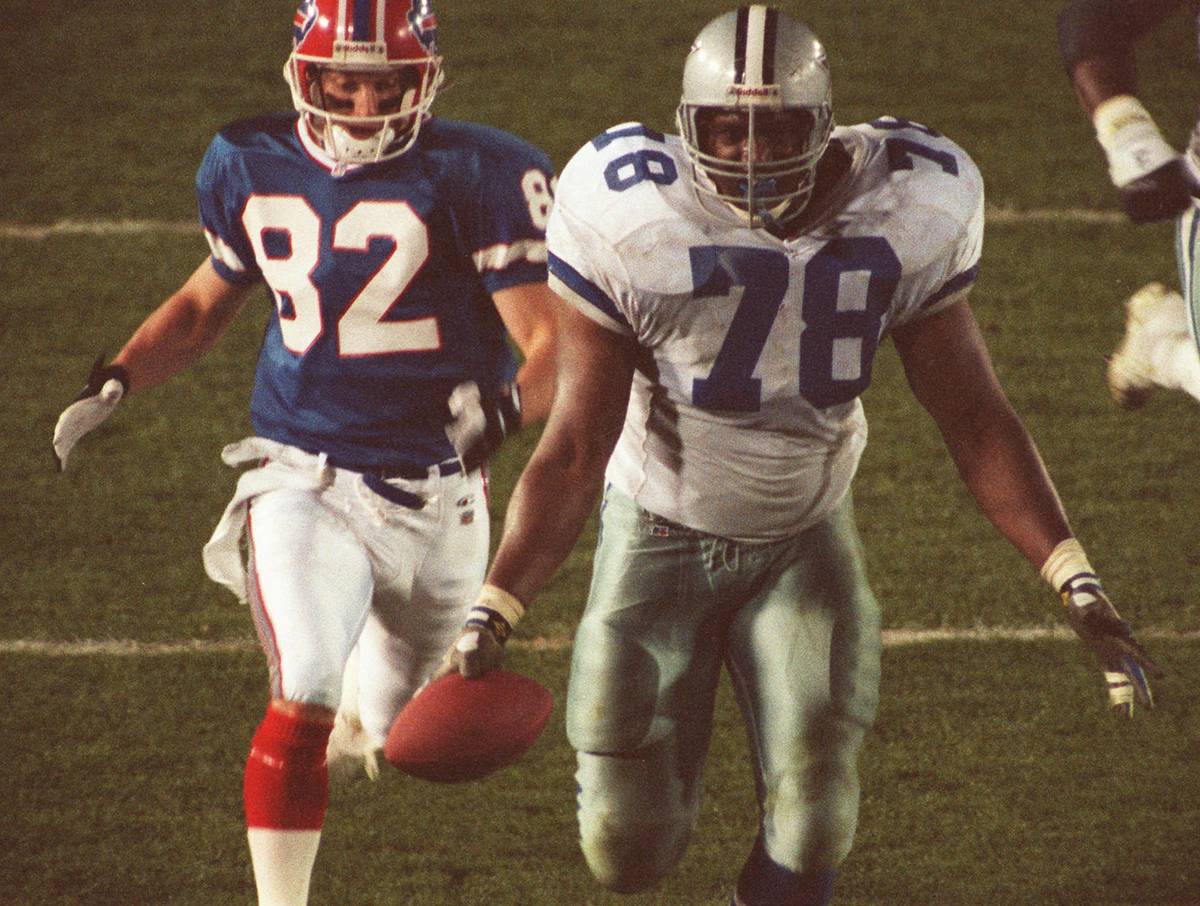 In this Jan. 31, 1993, file photo, Dallas Cowboys Leon Lett (78) begins to celebrate as he head ...