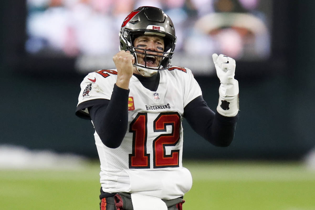 Tampa Bay Buccaneers quarterback Tom Brady reacts after winning the NFC championship NFL footba ...