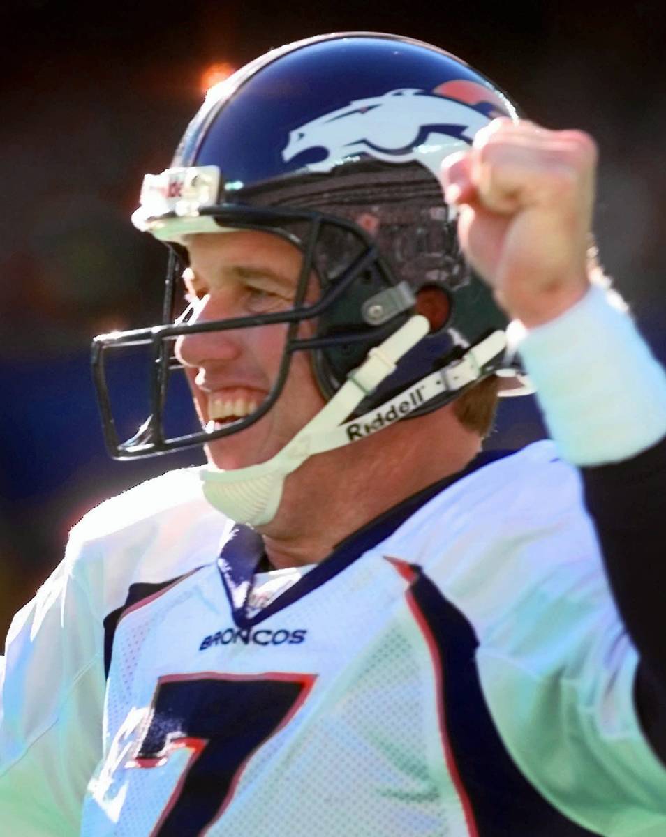 Denver Broncos quarterback John Elway celebrates his second-quarter touchdown pass against the ...
