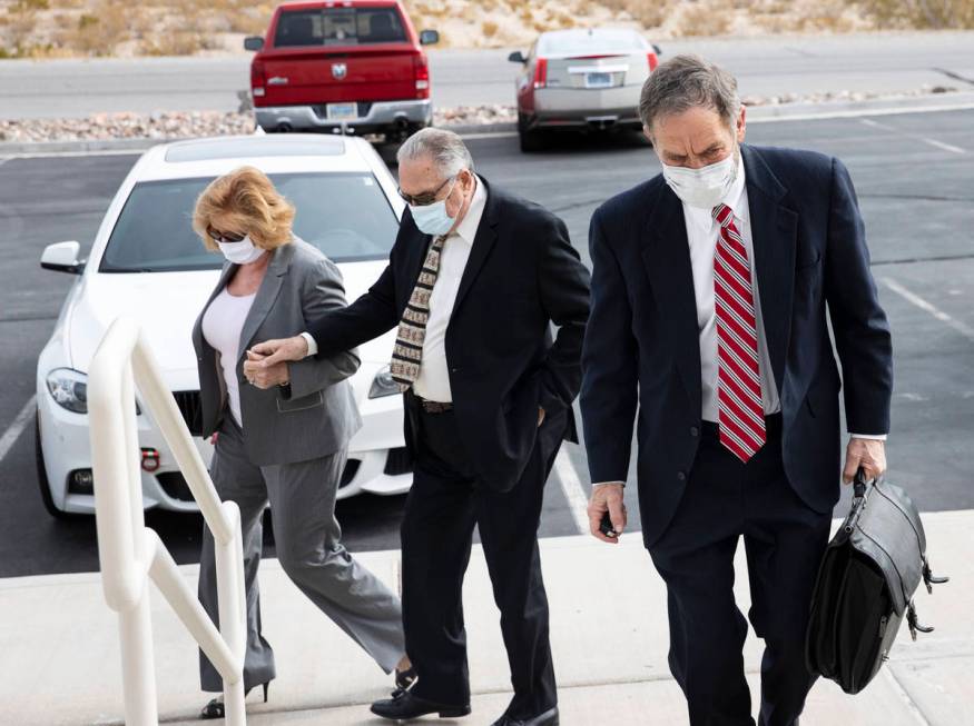 Patricia, left, and her husband Marcel Chappuis arrive with their attorney, Thomas Gibson, righ ...