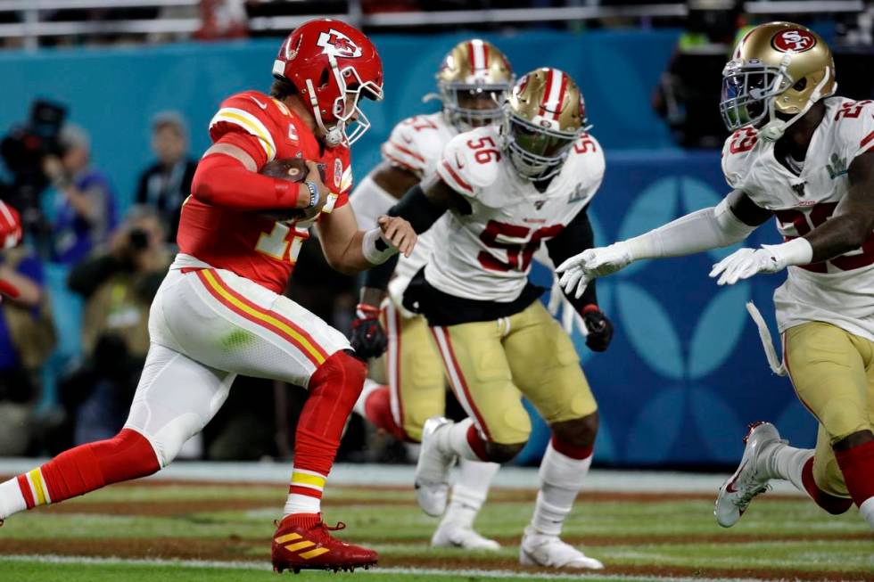 Kansas City Chiefs quarterback Patrick Mahomes runs for a touchdown against the San Francisco 4 ...