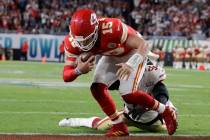 Kansas City Chiefs quarterback Patrick Mahomes (15) runs into the end zone for a touchdown agai ...