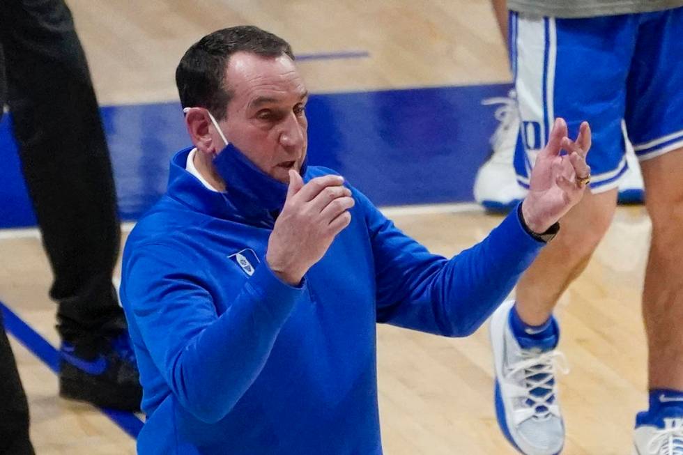 Duke coach Mike Krzyzewski calls to players during the first half of the team's NCAA college ba ...