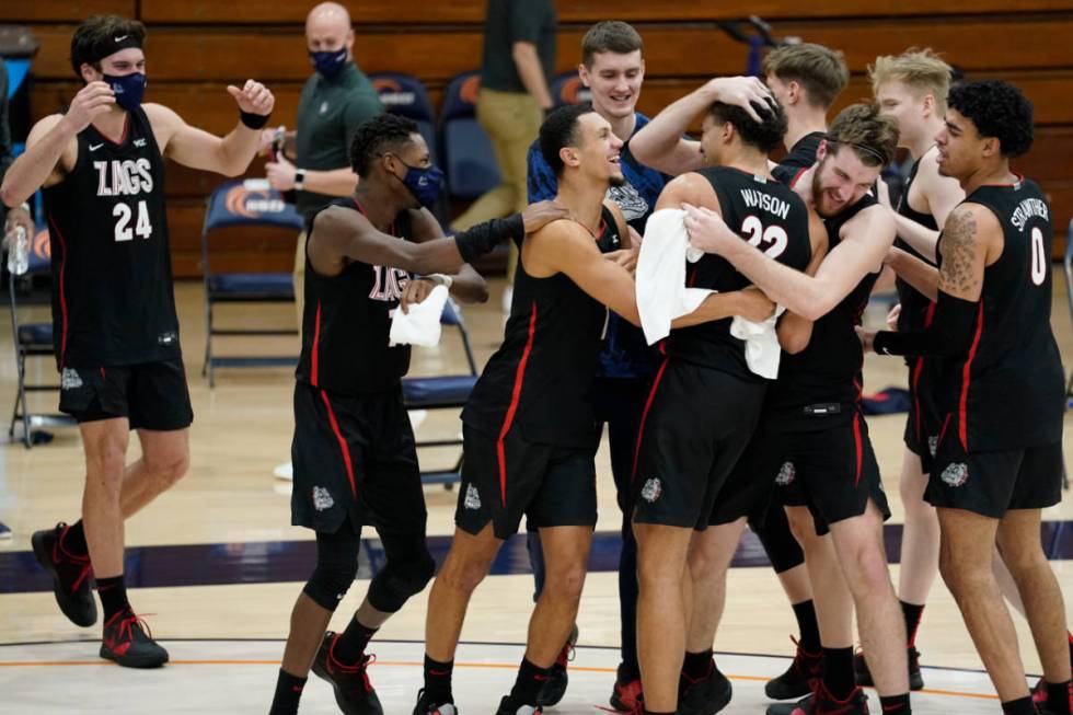 Gonzaga players celebrate after forward Anton Watson (22) dunked during the second half of the ...