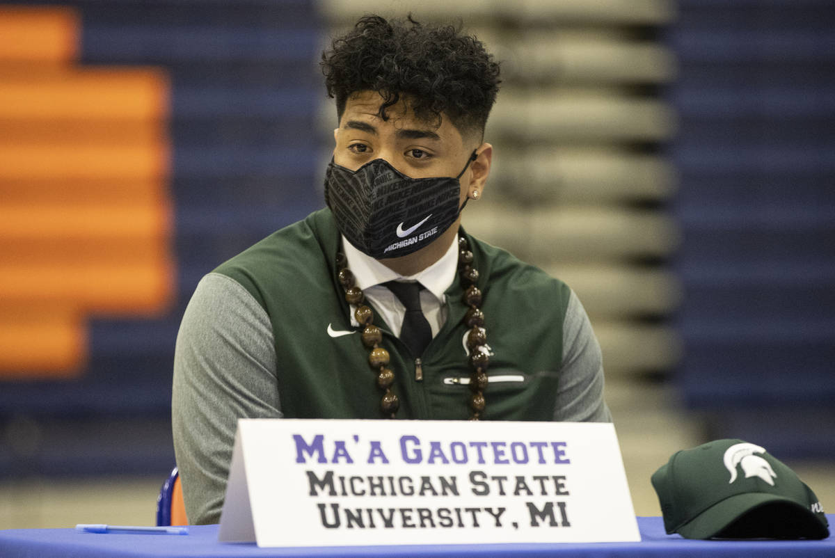 Football player Ma'a Gaoteote, a Michigan State commit, participates during a Signing day cerem ...