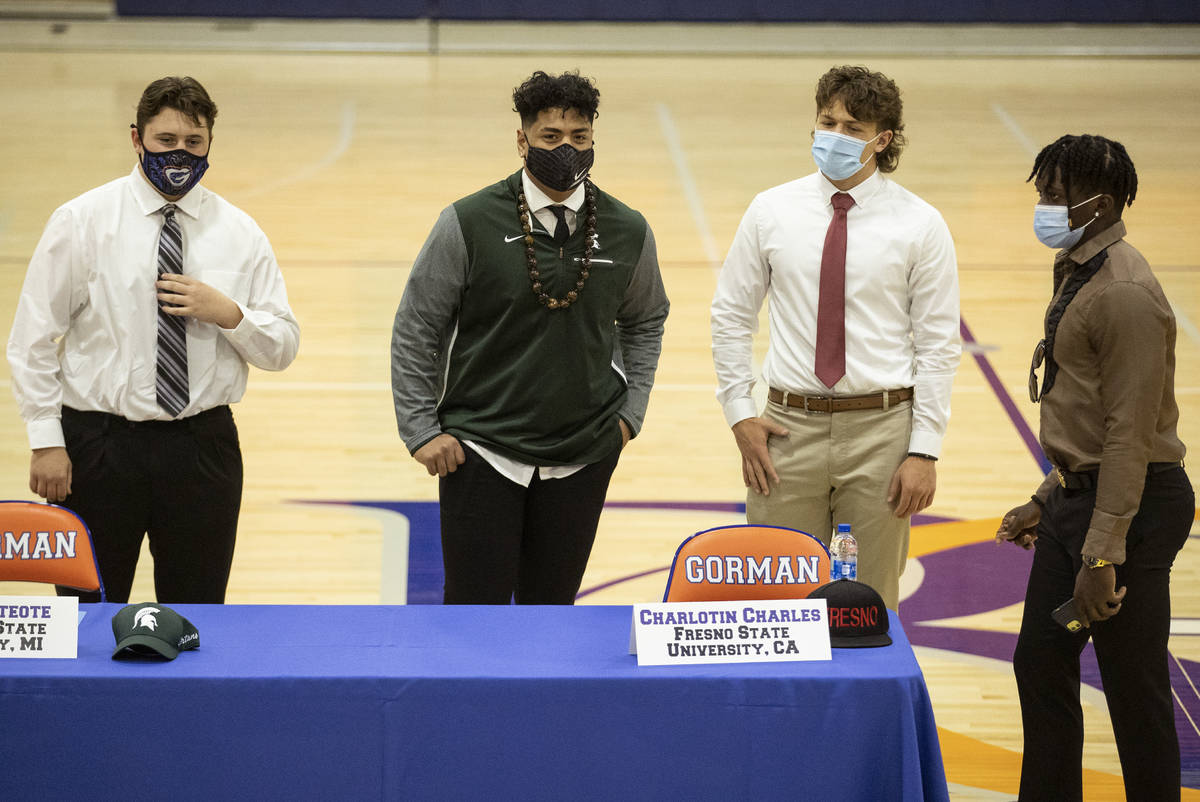 Football players from left, Sean McConnell, a Jamestown University commit, Ma'a Gaoteote, a Mic ...
