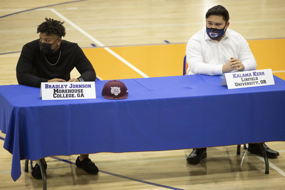 Football players Bradley Johnson, left, a Morehouse College commit, and Kalama Kerr, a Linfield ...