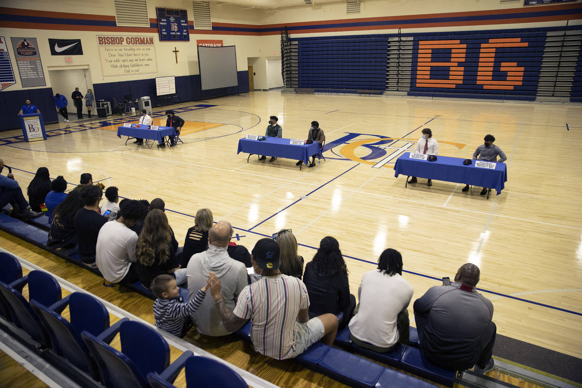 Students participate during a Signing day ceremony at Bishop Gorman High School in Las Vegas, o ...