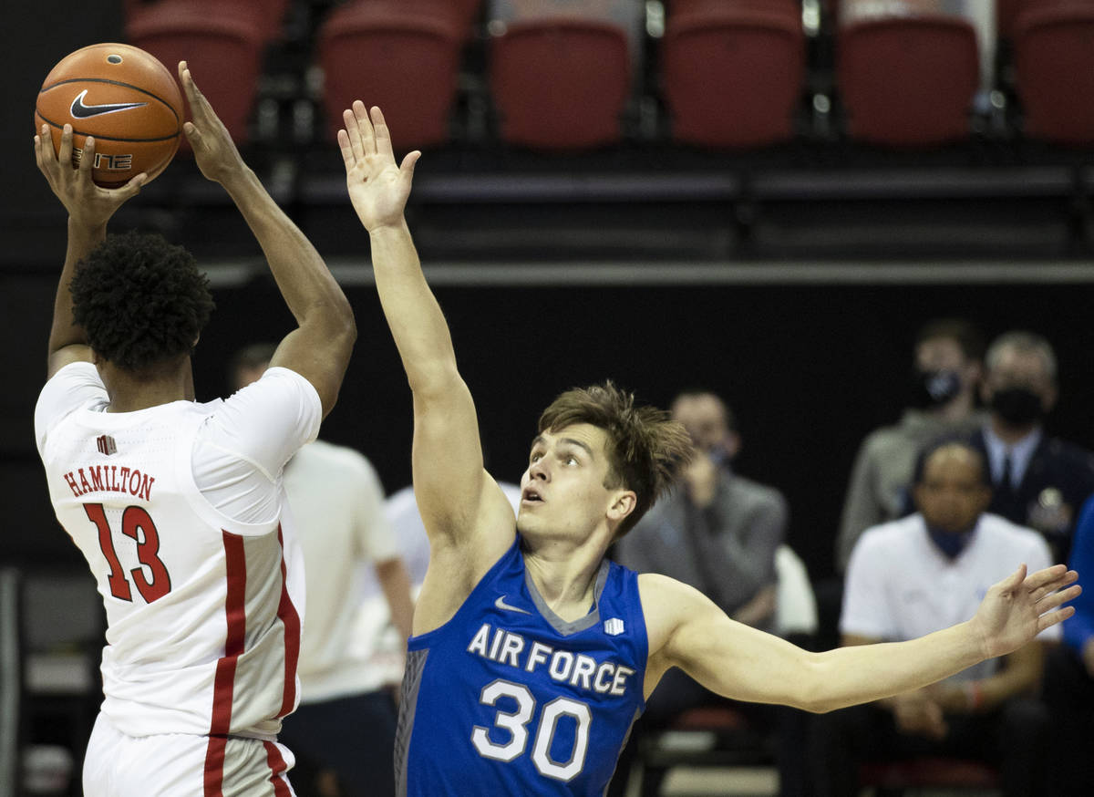 UNLV Rebels guard Bryce Hamilton (13) passes to the corner over Air Force Falcons guard Camden ...