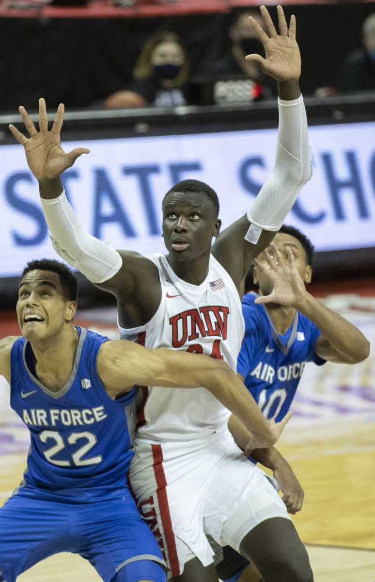 UNLV Rebels forward Cheikh Mbacke Diong (34) fights for a rebound with Air Force Falcons forwar ...