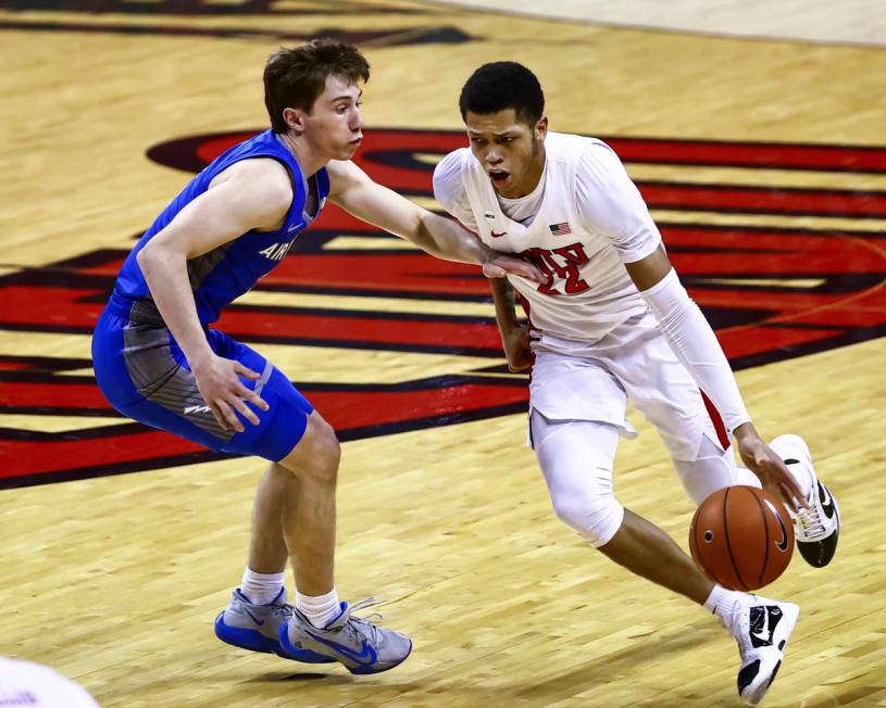 UNLV Rebels guard Nick Blake (22) drives to the basket against Air Force Falcons guard Glen McC ...