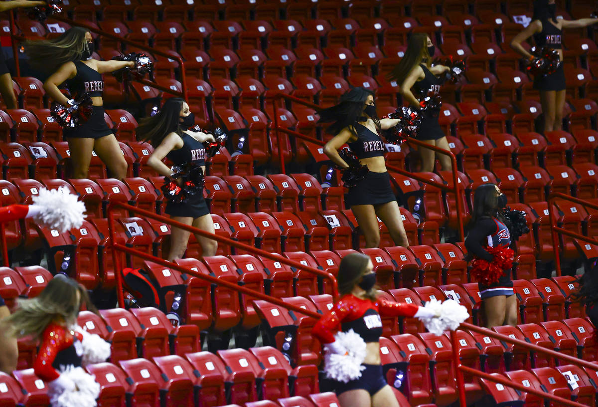 UNLV cheerleaders perform at the start of a basketball game against the Air Force Falcons at th ...