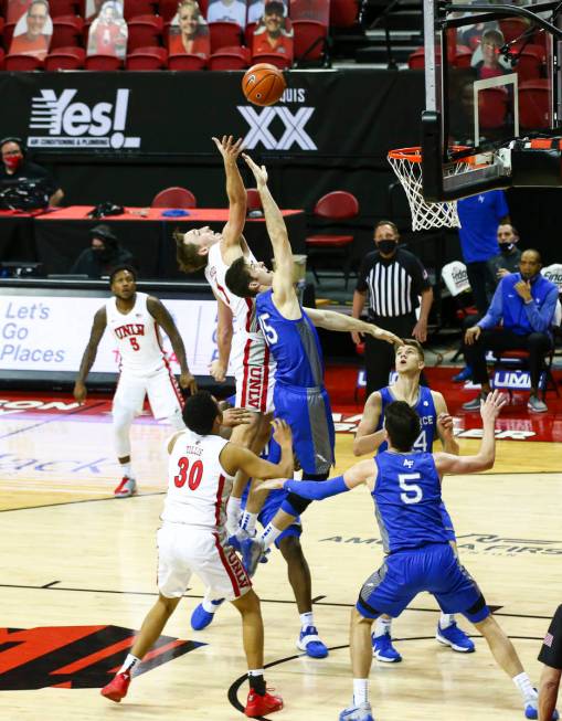 UNLV Rebels forward Moses Wood shoots over Air Force Falcons forward Abe Kinrade (15) during th ...