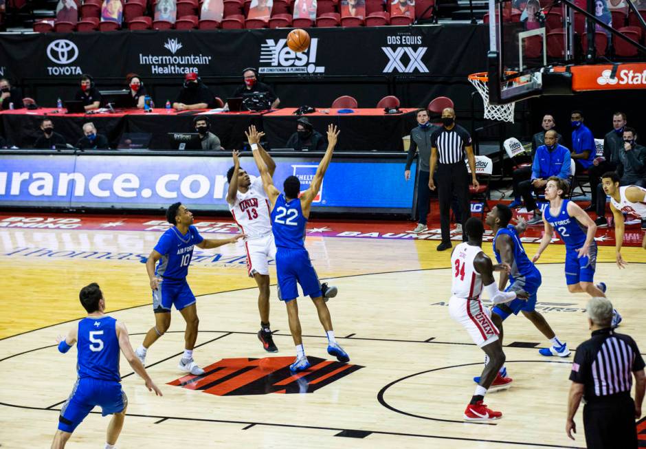 UNLV Rebels guard Bryce Hamilton (13) shoots over Air Force Falcons forward Nikc Jackson (22) d ...