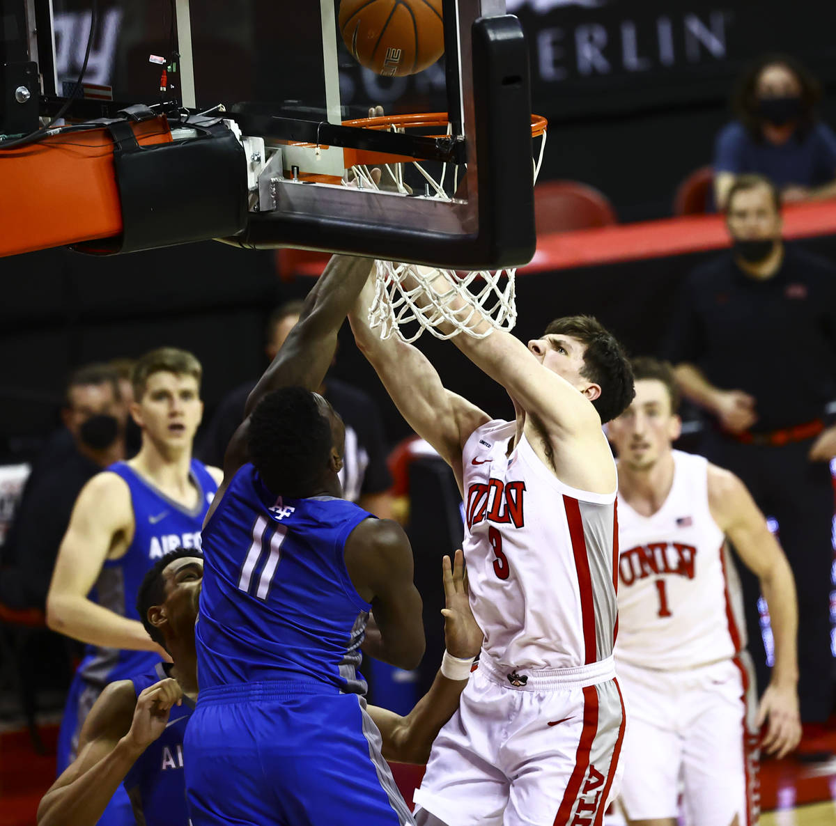 UNLV Rebels guard Caleb Grill (3) gets a shot in at the basket against Air Force Falcons guard ...