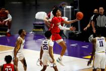 Texas Tech guard Terrence Shannon Jr. (1) drives to the basket past LSU guard Eric Gaines (25) ...