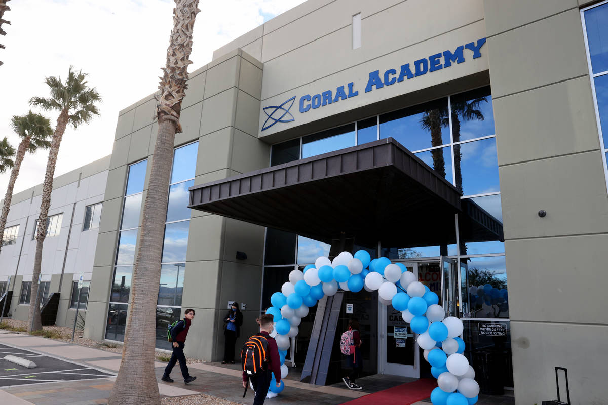 Students walk the red carpet at the start of school at Coral Academy of Science Las Vegas' Cent ...