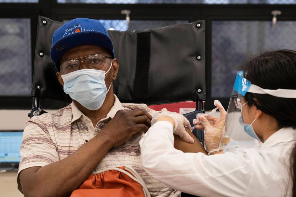 FILE - In this Jan. 15, 2021, file photo, a nursing home resident receives the COVID-19 vaccine ...