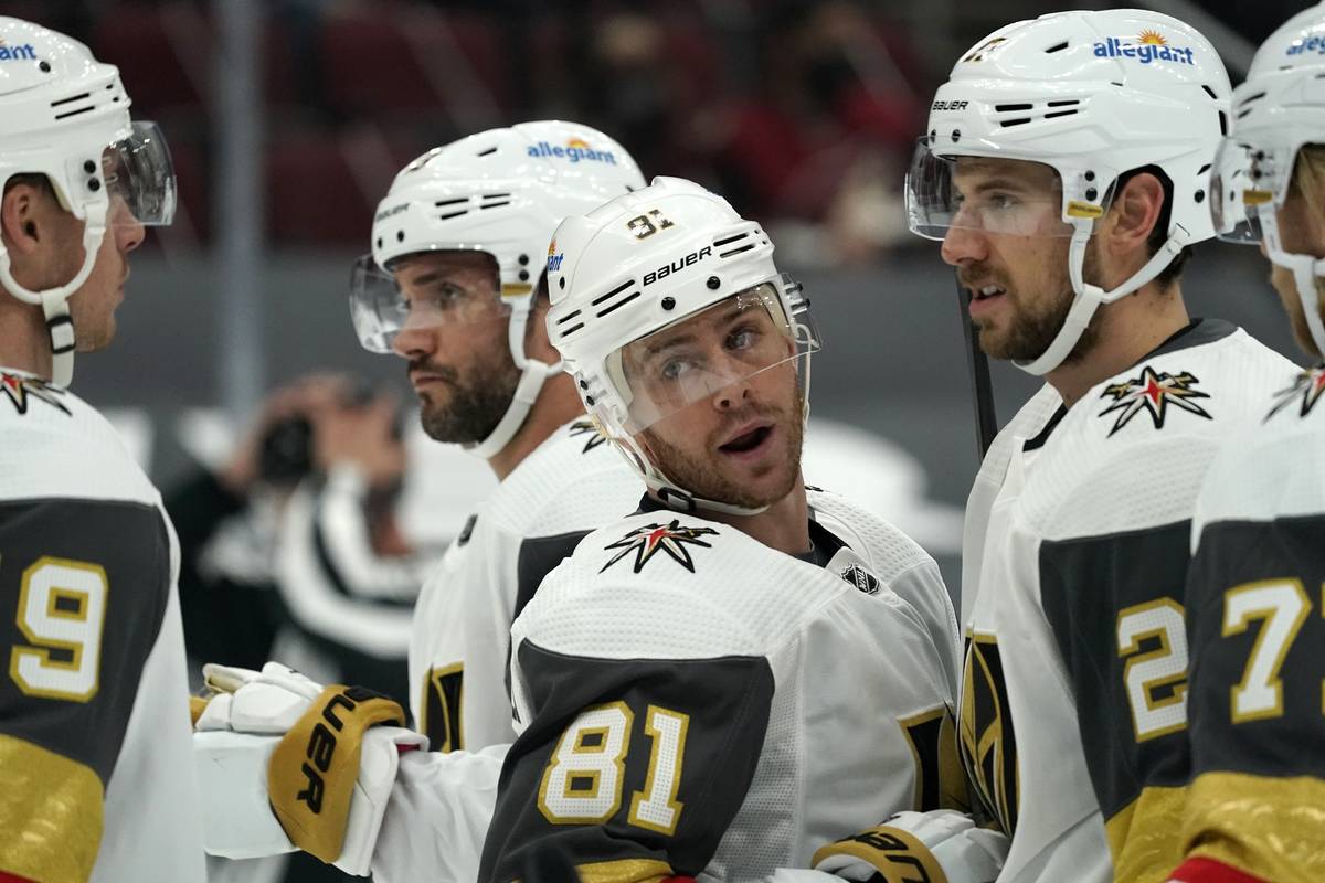 Vegas Golden Knights center Jonathan Marchessault (81) talks with his teammates during the firs ...