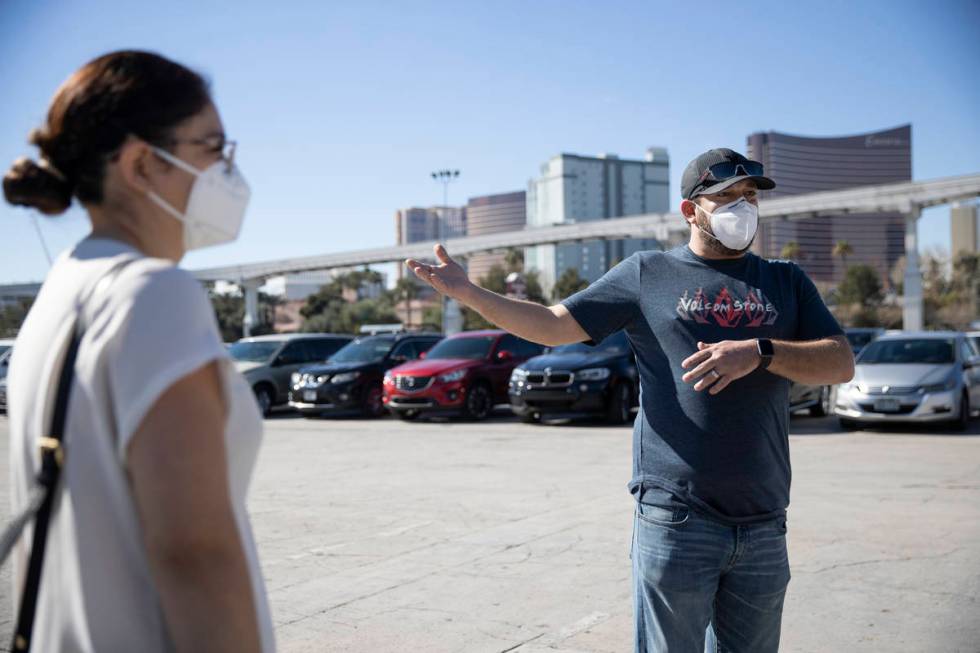 Fernando Alcaraz, right, is interviewed about his experience receiving his second dose of the C ...