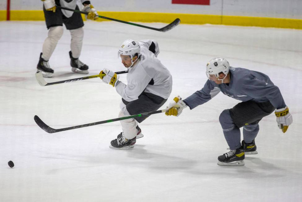 Henderson Silver Knights forward Dylan Sikura (15) skates after the puck as forward Jake Leschy ...