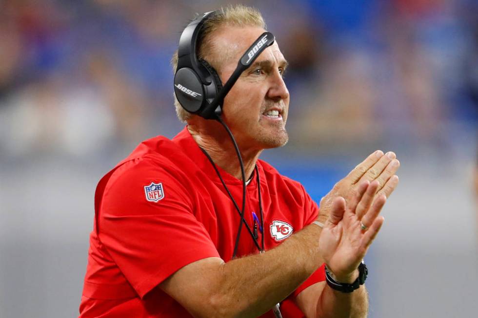 Kansas City Chiefs defensive coordinator Steve Spagnuolo signals during an NFL football game ag ...