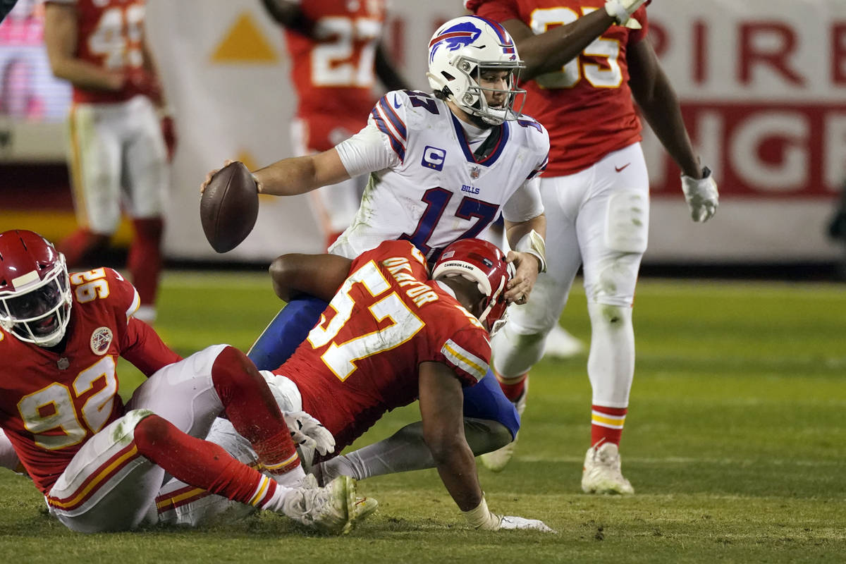 Buffalo Bills quarterback Josh Allen (17) is sacked by Kansas City Chiefs defensive end Alex Ok ...