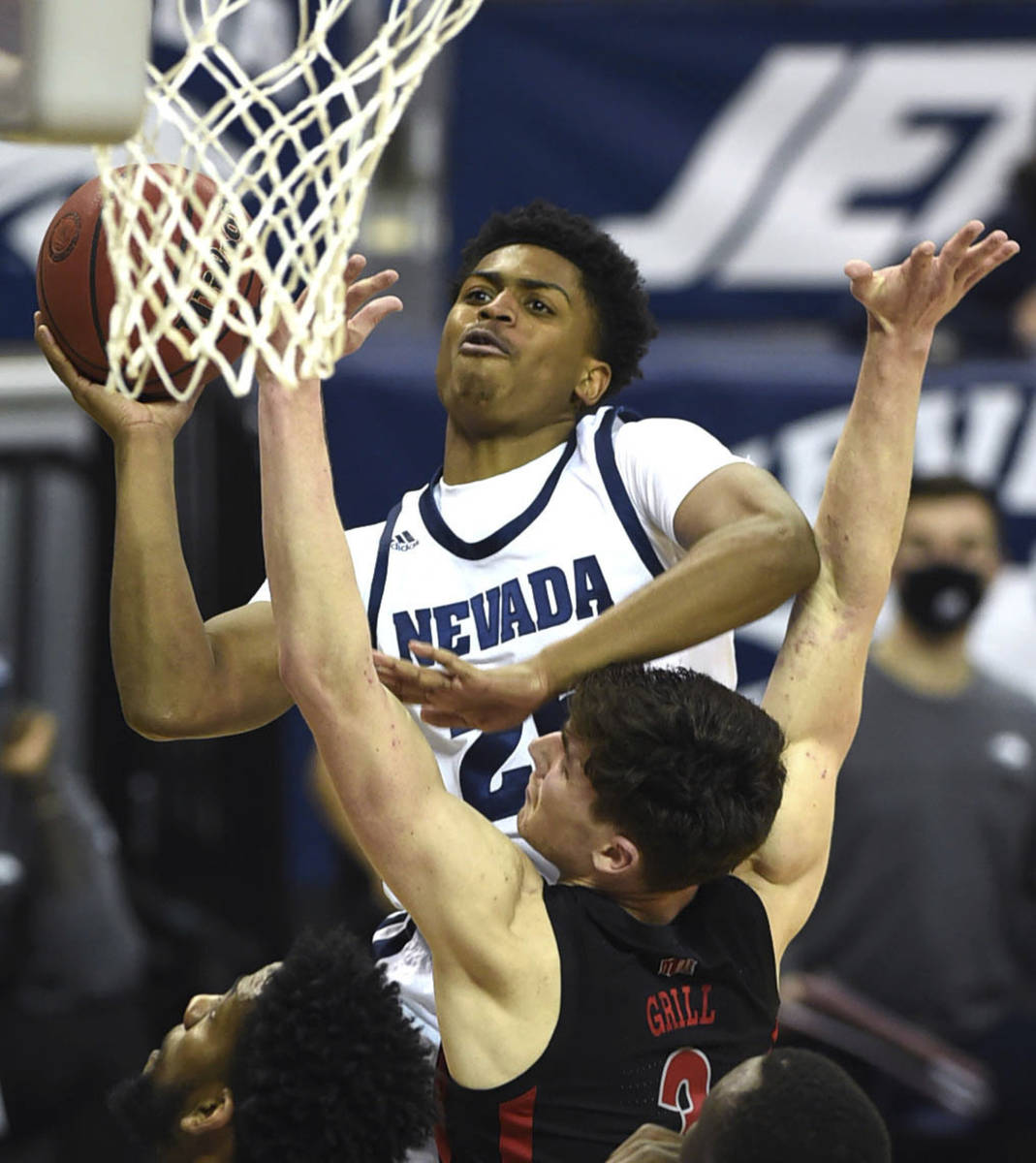 Nevada's Grant Sherfield shoots as UNLV 's Caleb Grill defends during the second half of an NCA ...