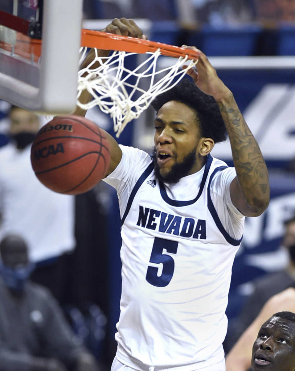 Nevada's Warren Washington dunks the ball against UNLV during the second half of an NCAA colleg ...