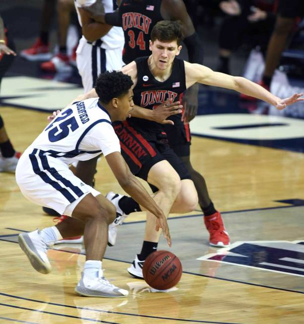 Nevada's Grant Sherfield dribbles the ball against UNLV during the first half of an NCAA colleg ...