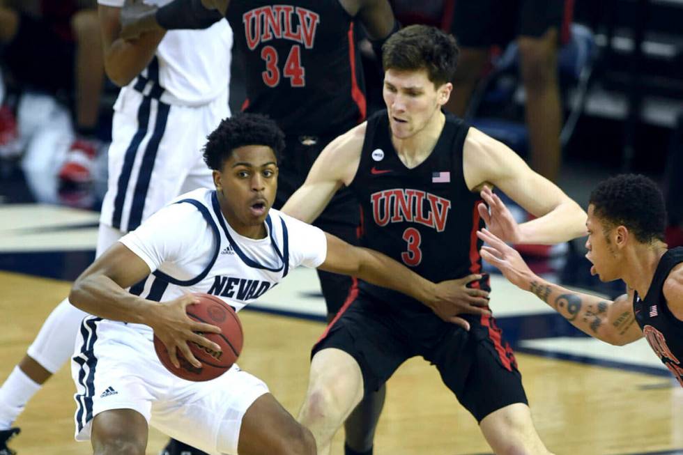 Nevada's Grant Sherfield dribbles the ball against UNLV during the first half of an NCAA colleg ...