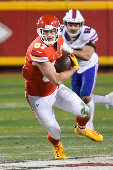 Kansas City Chiefs tight end Travis Kelce makes a catch and run for a first down against the Bu ...
