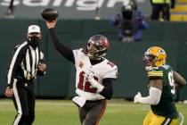 Green Bay Packers' Preston Smith watches as Tampa Bay Buccaneers quarterback Tom Brady throws a ...